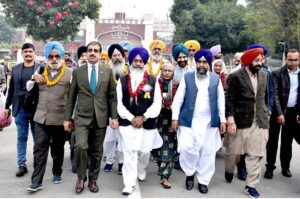 Shiromani Gurdwara Parbandhak Committee (SGPC) Amritsar Jatha Leader Khushminder Singh talking to media persons after arriving in Pakistan through Wagha Border to participate in religious rituals on the occasion of 554th Birth Anniversary of Guru Nanak at Nankana Sahib
