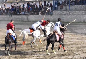Players from Leopards and Gilgit-01 teams in action during the final match of the Jashan-e-Azadi free polo tournament at Aga Khan Shahi polo ground. APP/AHS/FHA/ZID