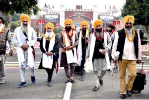 Shiromani Gurdwara Parbandhak Committee (SGPC) Amritsar Jatha Leader Khushminder Singh talking to media persons after arriving in Pakistan through Wagha Border to participate in religious rituals on the occasion of 554th Birth Anniversary of Guru Nanak at Nankana Sahib
