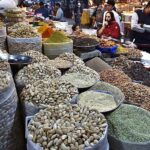 People purchasing the seasonal dry fruits and Daily home use different spices items at whole sale market outside the Delhi gate