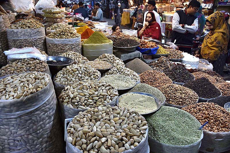 People purchasing the seasonal dry fruits and Daily home use different spices items at whole sale market outside the Delhi gate