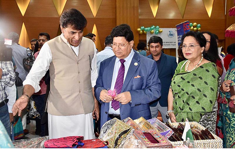 Pakistan's High Commissioner to Bangladesh, Syed Ahmed Maroof showing Pakistani handicrafts to Foreign Minister of Bangladesh Dr. A.K Abdul Momen during visit of the Minister to Pakistani Stall at the International Charity Bazar