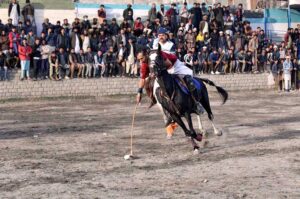 Players from Leopards and Gilgit-01 teams in action during the final match of the Jashan-e-Azadi free polo tournament at Aga Khan Shahi polo ground. APP/AHS/FHA/ZID