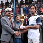 Secretary Forest Gilgit-Baltistan Zafar Waqar Taj giving away trophy to the player of the match during the final match of the Jashan-e-Azadi free polo tournament at Aga Khan Shahi polo ground
