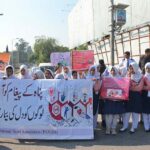 A large number of students participating in an awareness walk regarding Diabetes on the eve to mark World Diabetes Day organized by Pakistan National Heart Association at National Press Club Islamabad