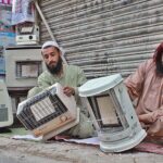 Man repairs gas heater at main Quetta bazaar