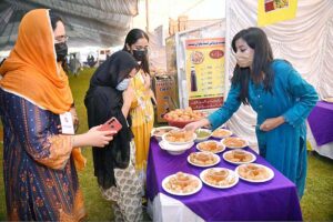 Female students purchasing traditional food item "Gol Gappey' from the stall during second day of First Dosti Women Literature Festival, 1st Edition at SBBWU