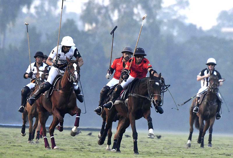 Players struggling to get hold on the ball during polo match played between Pebble Breaker and Barry`s Polo during Aibak Polo Cup 2023 at Lahore Polo Club