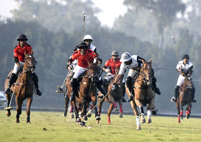 Players struggling to get hold on the ball during polo match played between Pebble Breaker and Barry`s Polo during Aibak Polo Cup 2023 at Lahore Polo Club