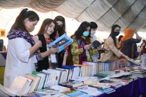 Female students purchasing traditional food item "Gol Gappey' from the stall during second day of First Dosti Women Literature Festival, 1st Edition at SBBWU