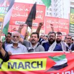 Journalists holding playcards during a rally in support of Palestinians, and express solidarity with Palestinian journalists and their families during Gaza March (Save Gaza Save Journalists) at the Karachi Press club to Governor House Sindh