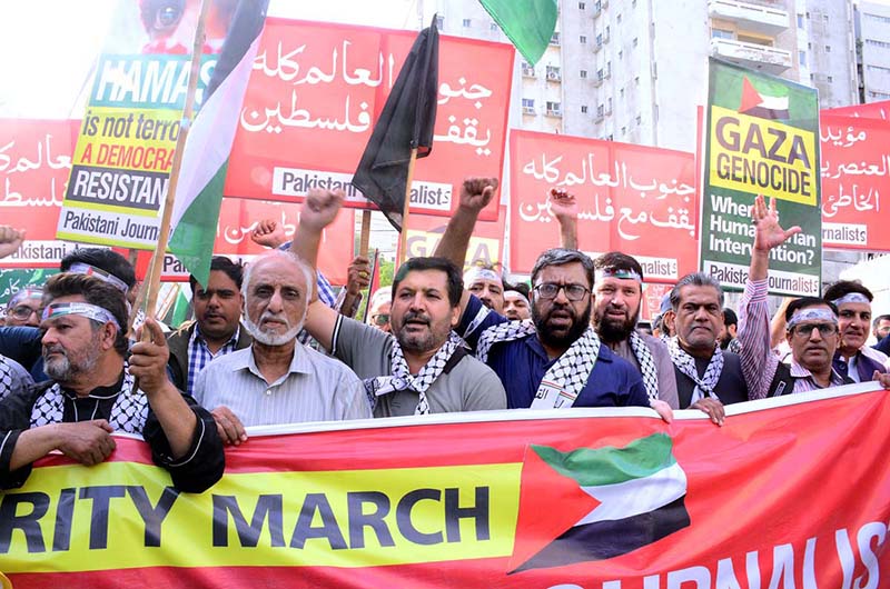 Journalists holding playcards during a rally in support of Palestinians, and express solidarity with Palestinian journalists and their families during Gaza March (Save Gaza Save Journalists) at the Karachi Press club to Governor House Sindh