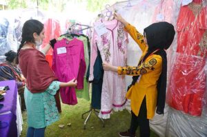 Female students purchasing traditional food item "Gol Gappey' from the stall during second day of First Dosti Women Literature Festival, 1st Edition at SBBWU