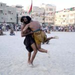 Wrestlers in action during Sindhi Malakra wrestling match in a tournament at Chanesar Goth