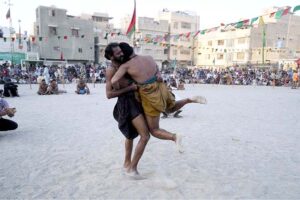 Wrestlers in action during Sindhi Malakra wrestling match in a tournament at Chanesar Goth