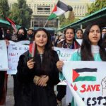 Students holding the peace walk of “Free Palestine day” at Isra University