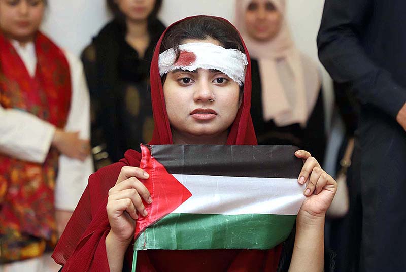 Students holding the peace walk of “Free Palestine day” at Isra University