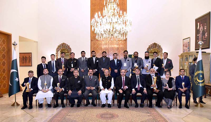 President Dr Arif Alvi in a group photo with the recipients of the 14th Lahore Chamber of Commerce and Industry Achievement Recognition Shields, at Aiwan-e-Sadr