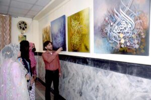 A one-day calligraphy exhibition by Khadim Hussain Rafat calligrapher at Khana Farhang, Islamic Republic of Iran, shows keen interest of people