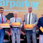 Caretaker Federal Minister for National Food Security & Research Dr. Kausar Abdullah Malik showing "Ecological Baseline Survey Report Tharparkar" to media persons after the launching ceremony. Country representative IUCN Pakistan Mr. Mahmood Cheema and CEO Sindh Engro Coal Mining Company Amir Iqbal also seen on the eve