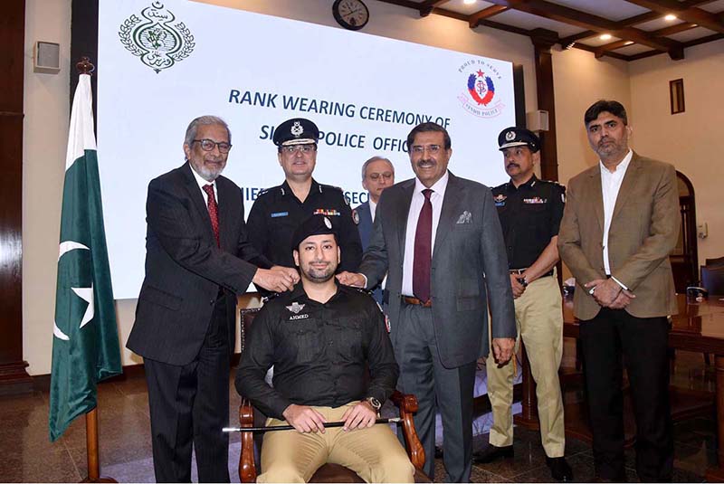 Caretaker Sindh Chief Minister Justice (R) Maqbool Baqar performs a wearing ceremony for the newly promoted police officers from ASP BS-17 to SP BS-18 at CM House. Caretaker Home Minister Brigadier (R) Haris Nawaz, IG Police Riffat Mukhtar and DIG Pir Mohammad Shah are also present