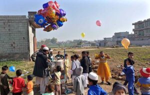 A street vendor dislaying different kinds of balloons to attrrat children at Tramri Chowk