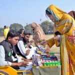 Visitor girl purchasing food items from the stall during the Special Sports Festival to mark International Day of Persons with Disabilities