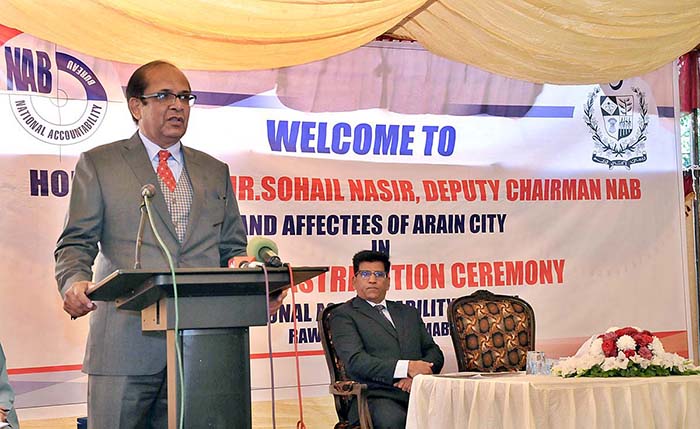 Deputy Chairman NAB Sohail Nasir addressing during ceremony of cheque distribution among affectees of Arain City at NAB Headquarters.