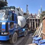 Labourers busy in construction work of a home at G-7 in Federal Capital