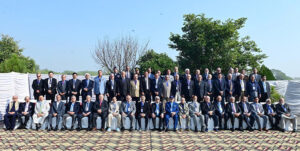 Caretaker Prime Minister Anwaar-ul-Haq Kakar in a group photo with former and serving Inspector Generals of Police at the 7th AFIGP Conference