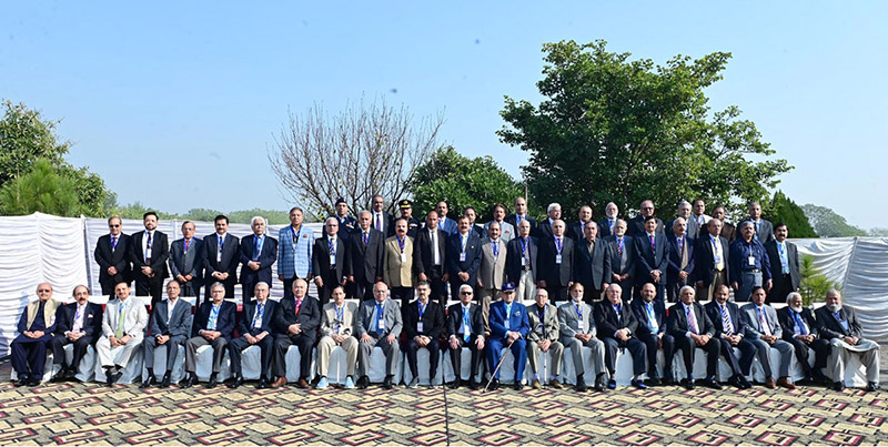 Caretaker Prime Minister Anwaar-ul-Haq Kakar in a group photo with former and serving Inspector Generals of Police at the 7th AFIGP Conference