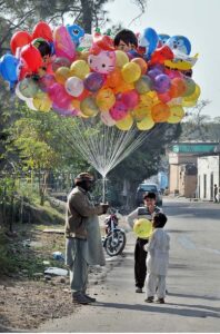 A street vendor selling balloons at G-7 in Federal Capital