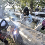 SNGPL staffers welding gas pipes installing at Zeropoint area in federal capital