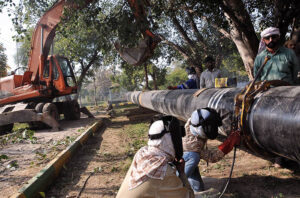SNGPL staffers busy welding gas pipeline during installation at G-7 area in the Federal Capital.