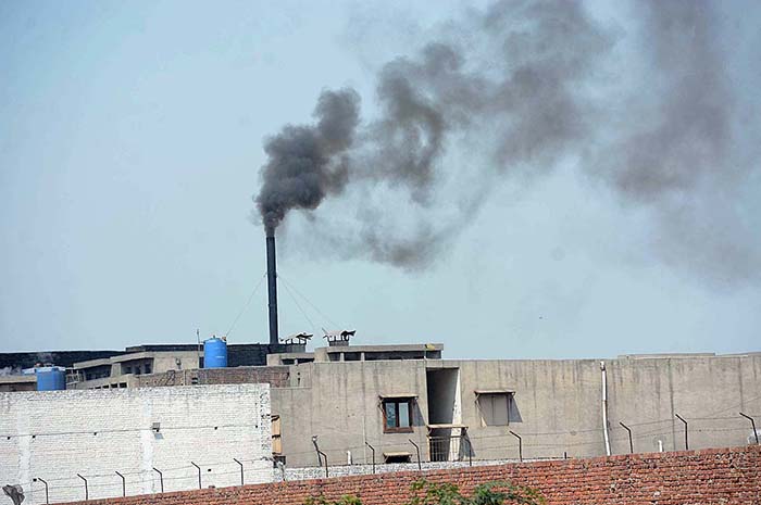 A view of smoke emitting from factory’s chimneys at Bypass Jhang Road creates environmental problems and needs attention to the concerned authorities