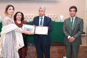 Caretaker Federal Minister for Information, Broadcasting and Parliamentary Affairs, Murtaza Solangi giving away certificates to the graduates during the graduation ceremony of 38th MCMC Domain Specific Training and 40th Specialized Training Program at Information Service Academy Auditorium.