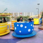 Children enjoying the mechanized swing during their winter vacations at Joyland.