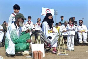 Visitor girl purchasing food items from the stall during the Special Sports Festival to mark International Day of Persons with Disabilities