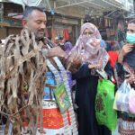 A vendor selling ‘dandasa’ (peel of walnut tree) used for natural teeth whitening in a local market