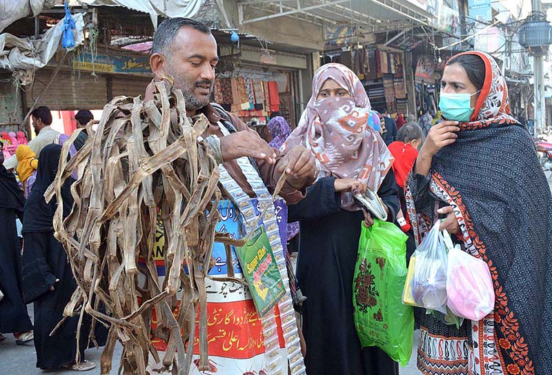 A vendor selling ‘dandasa’ (peel of walnut tree) used for natural teeth whitening in a local market