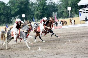 Horse riders aiming their target in the Tent Pegging Championship 2023 organized by the Directorate of Farms at University of Agriculture, Faisalabad (UAF