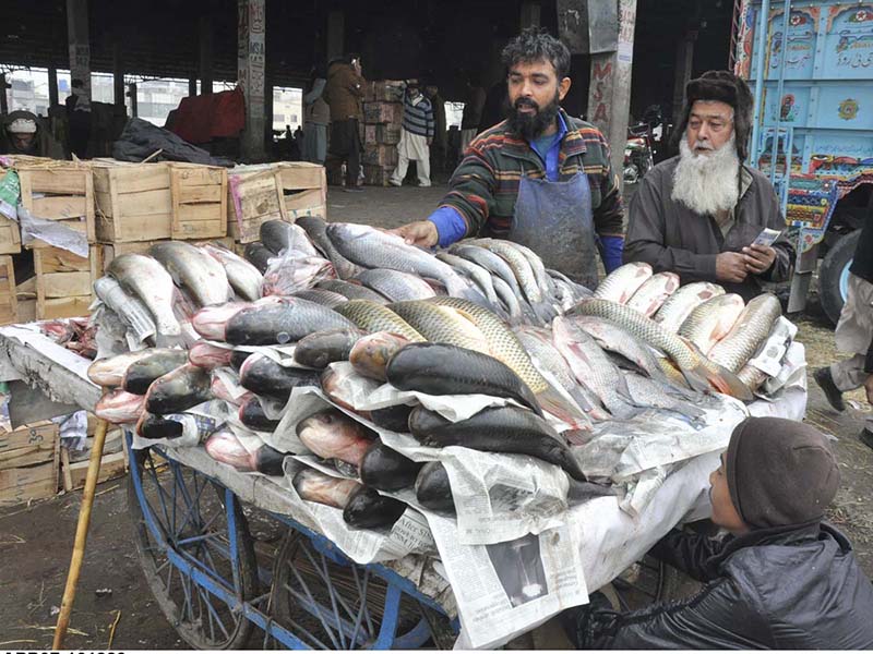 A vendor selling fish at vegetables Market in Federal Capital