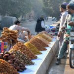 Vendor is displaying and selling dry fruit at General Bus Stand road.