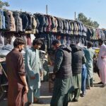 People busy in selecting and purchasing jackets from vendors at Bomb Chowk.