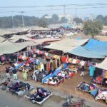 Vendors displaying and selling second-hand warm clothes to attract the customers at Landa Bazaar