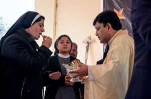 Christian community members performing religious rituals on Christmas day at Fatima Church.
