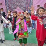 Students performing in tableau during culture program at RC School