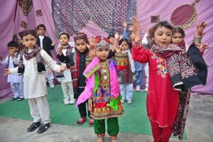 Students performing in tableau during culture program at RC School