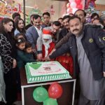 Managing Director Associated Press of Pakistan, Muhammad Asim Khichi along with Christian employees cutting cake in connection with Christmas celebrations.