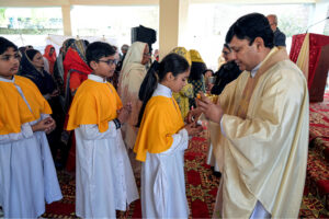 Christian community members performing religious rituals on Christmas day at Fatima Church.